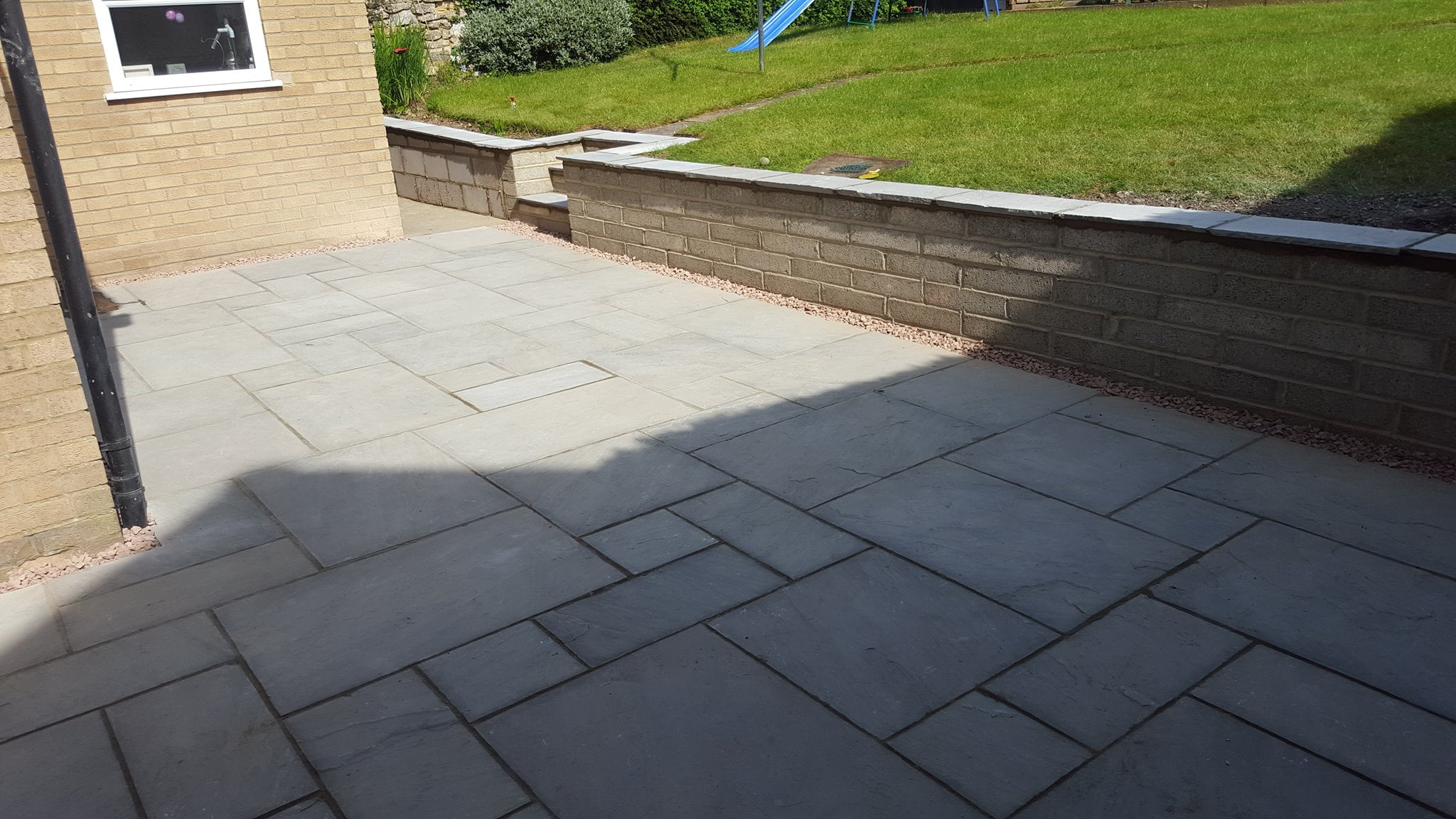 Before and after of a patio retaining wall in Woodstock 4